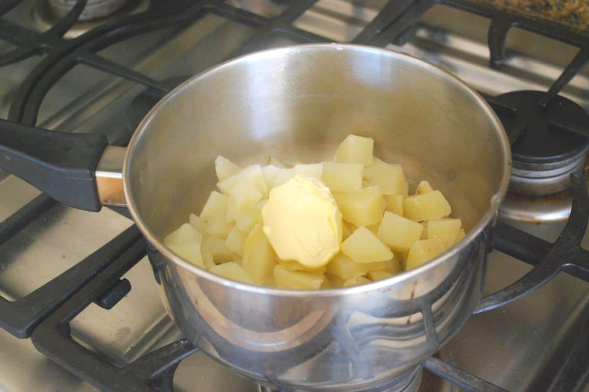 potatoes in a sauce pan with butter.