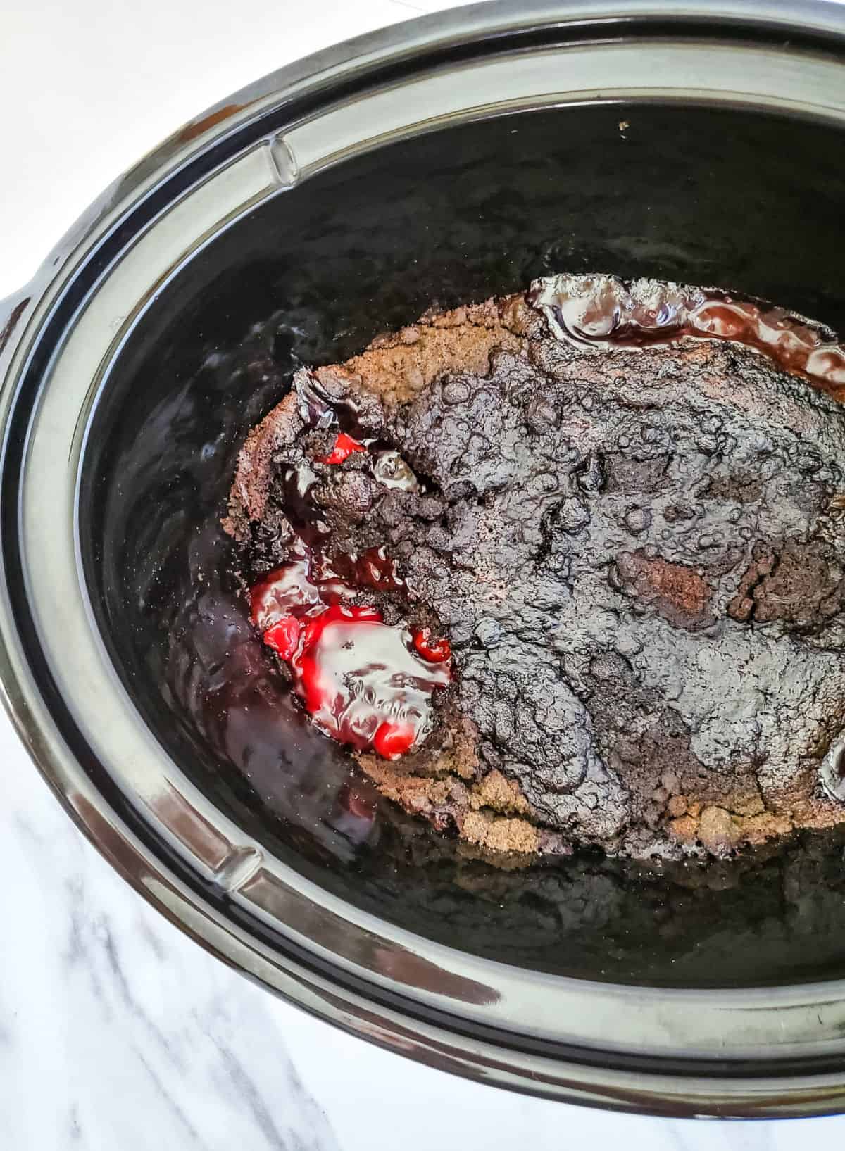chocolate cherry dump cake in a slow cooker.