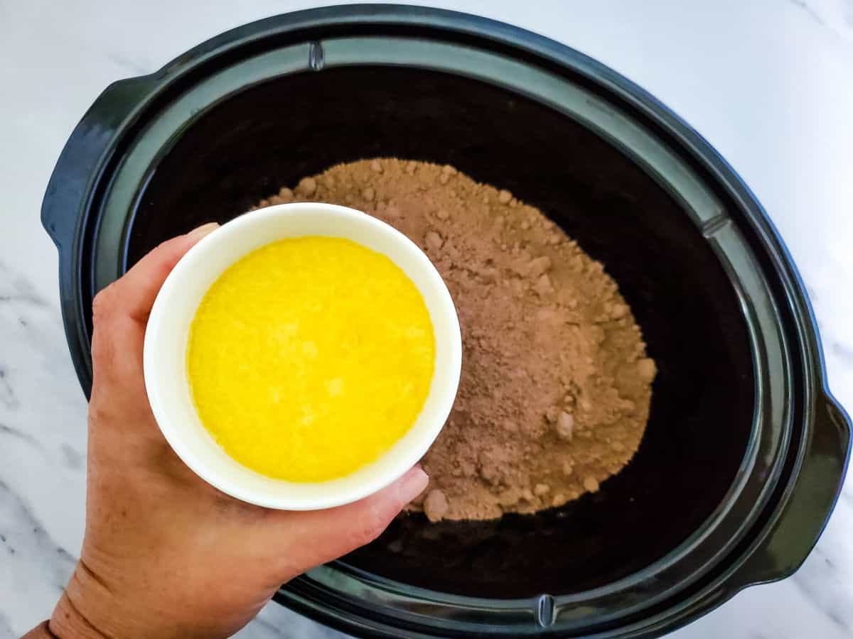 chocolate cake mix in a crock pot and butter.