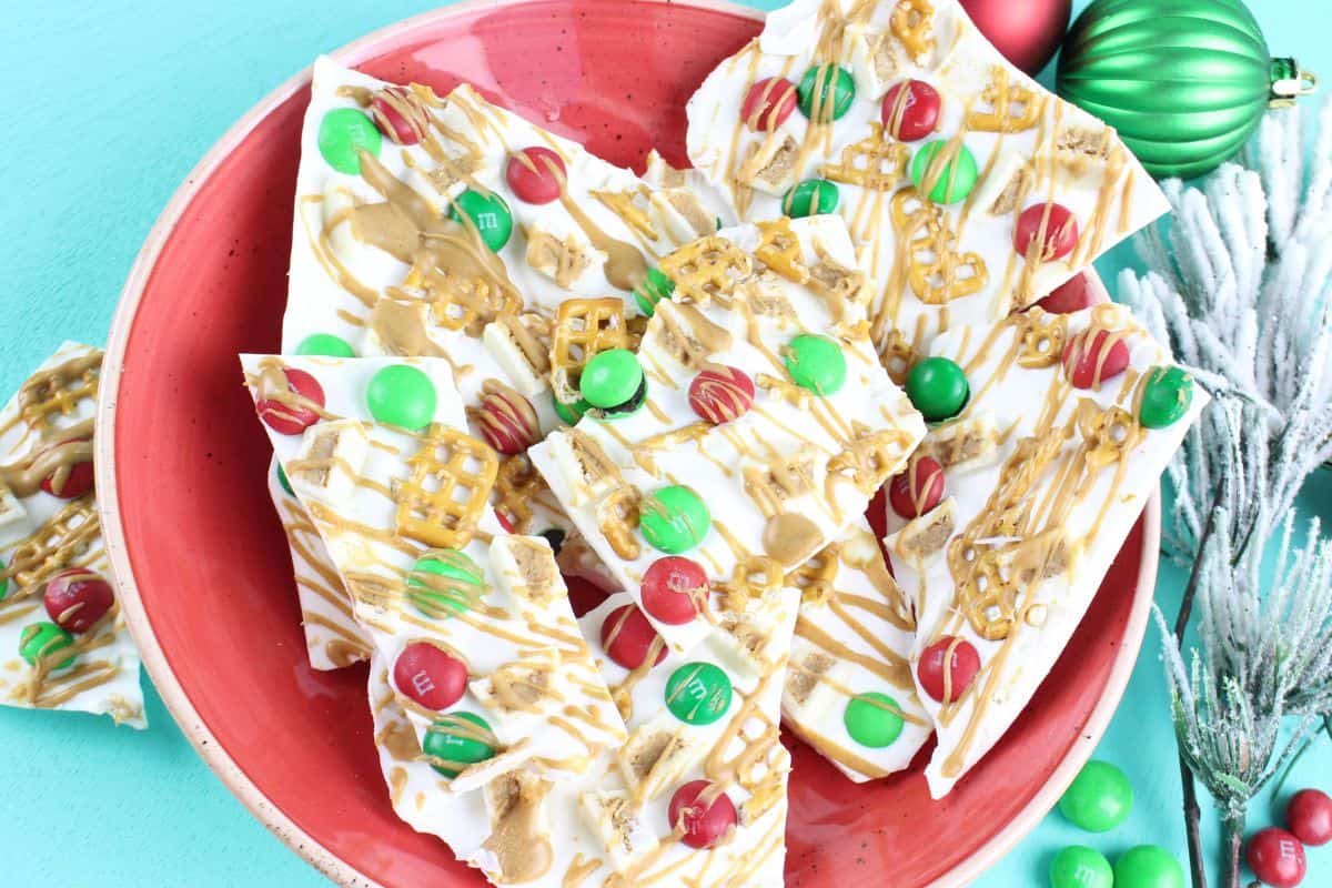 white chocolate bark with candy on white plate.