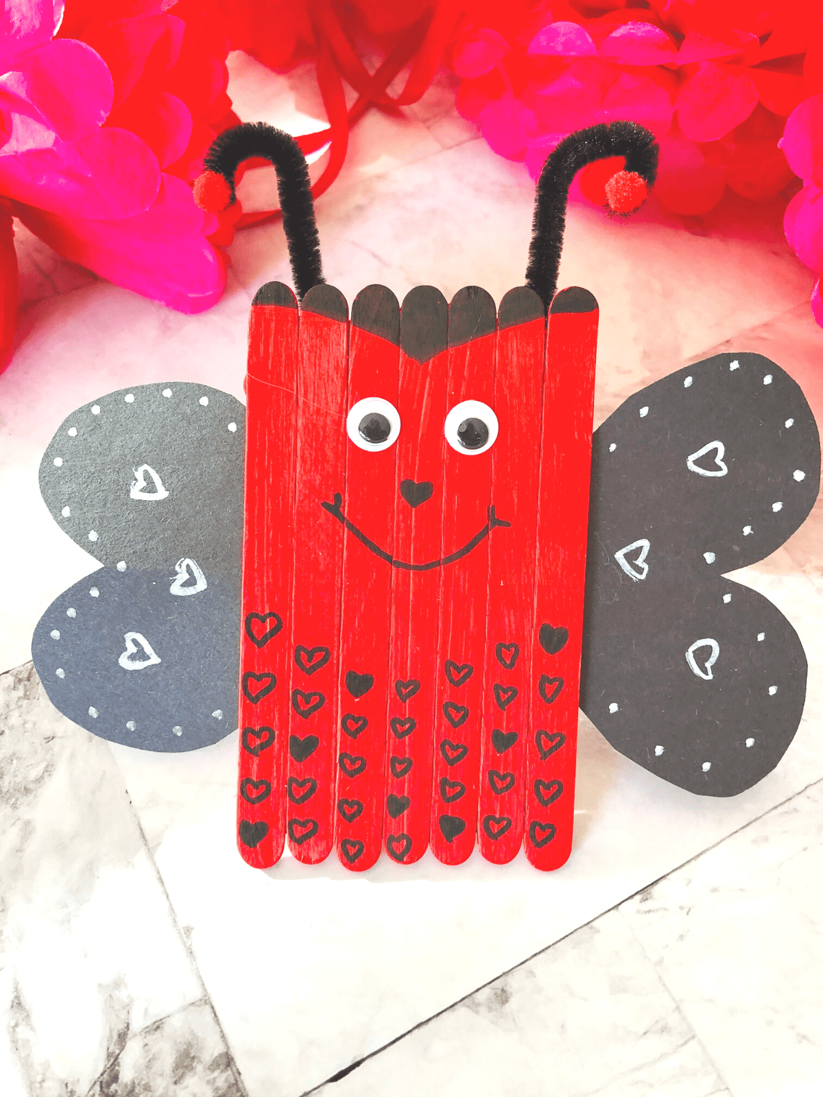 lady bug valentines craft made with popsicle sticks