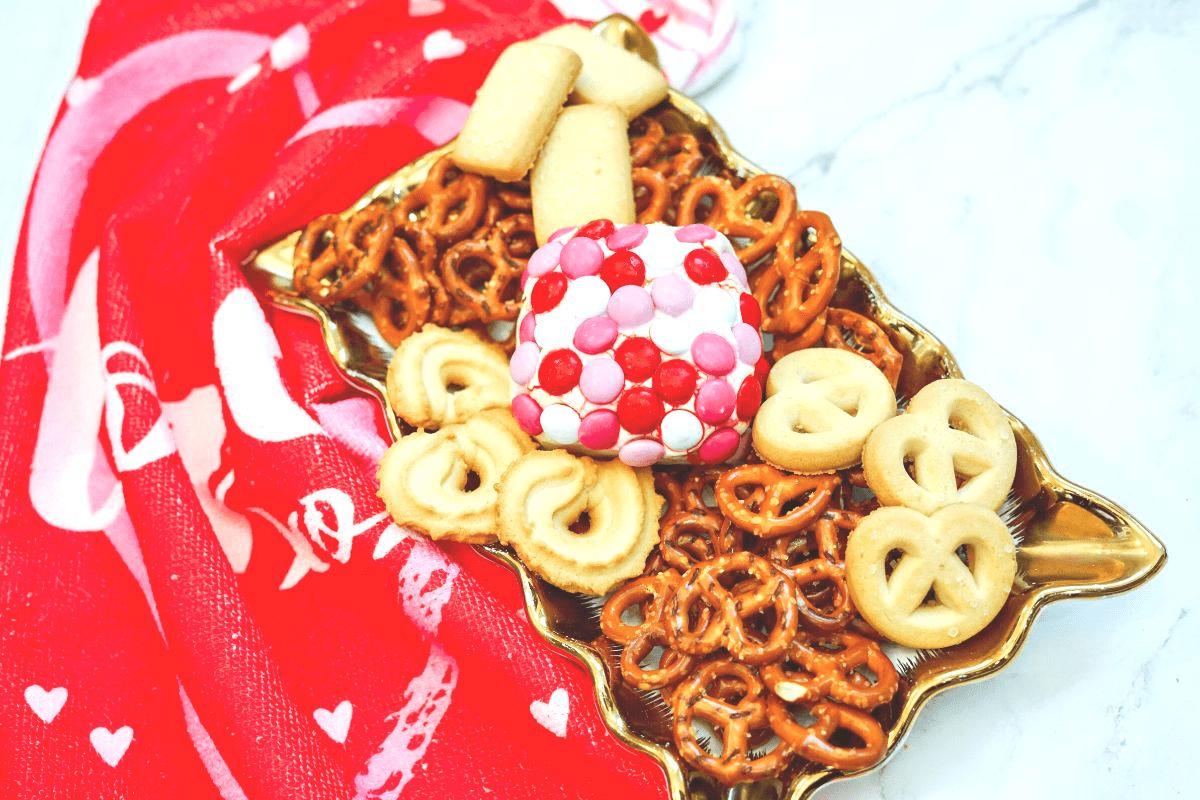 valentines dessert cheese ball with cookies and pretzels
