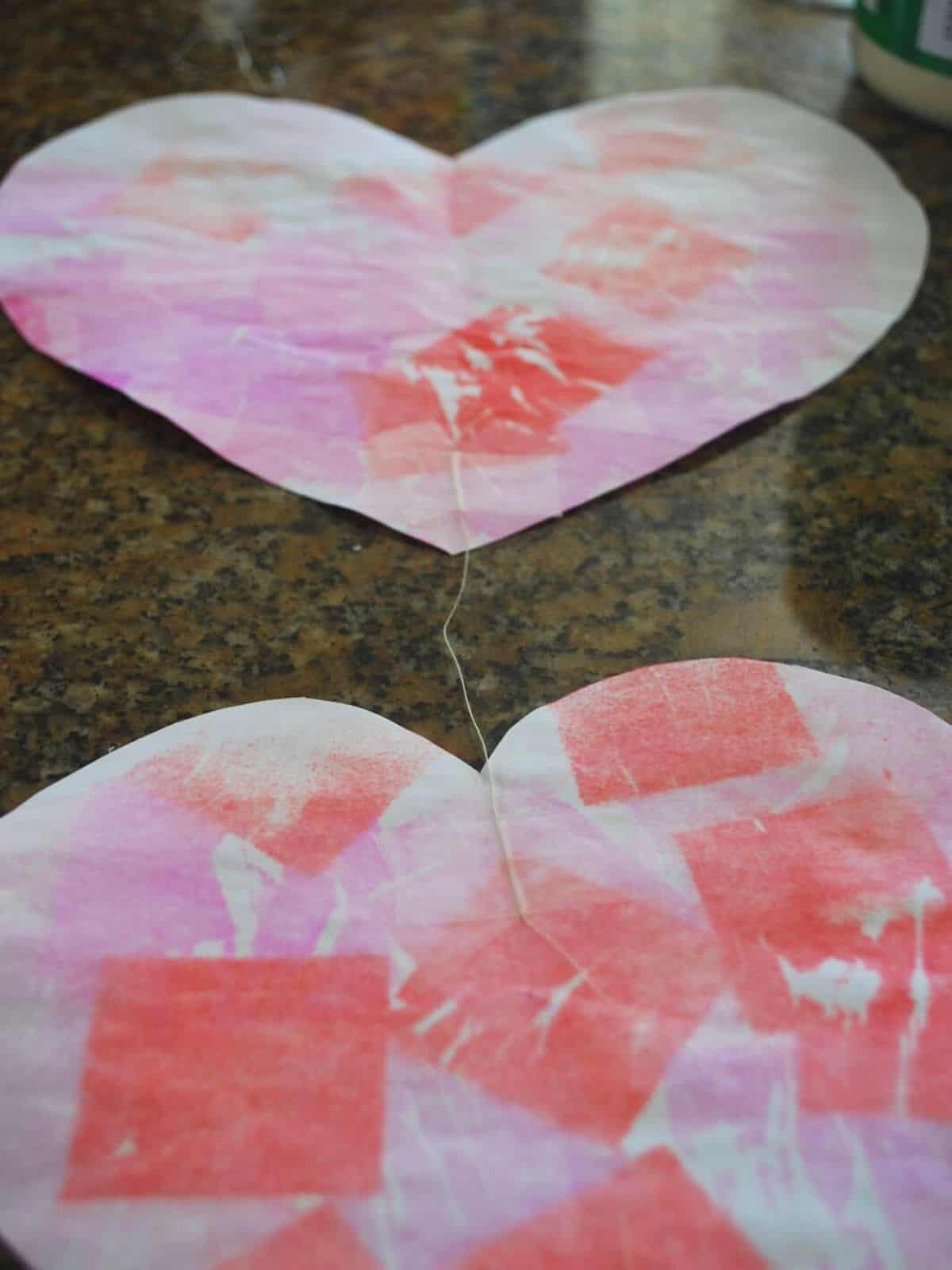 attaching thread to paper hearts