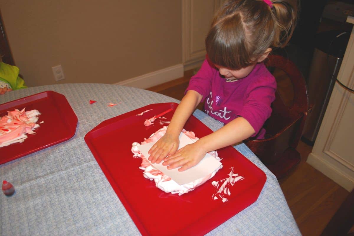 kid made valentine's cards pressing paper on shaving cream