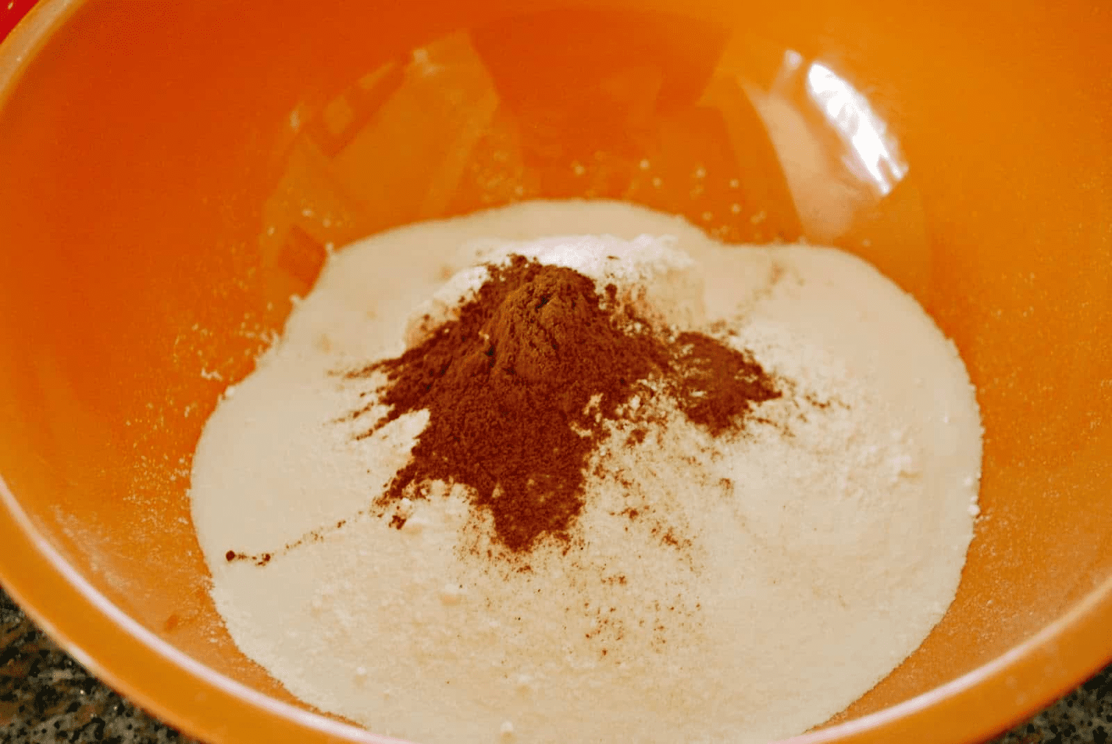flour sugar and cinnamon in an orange bowl