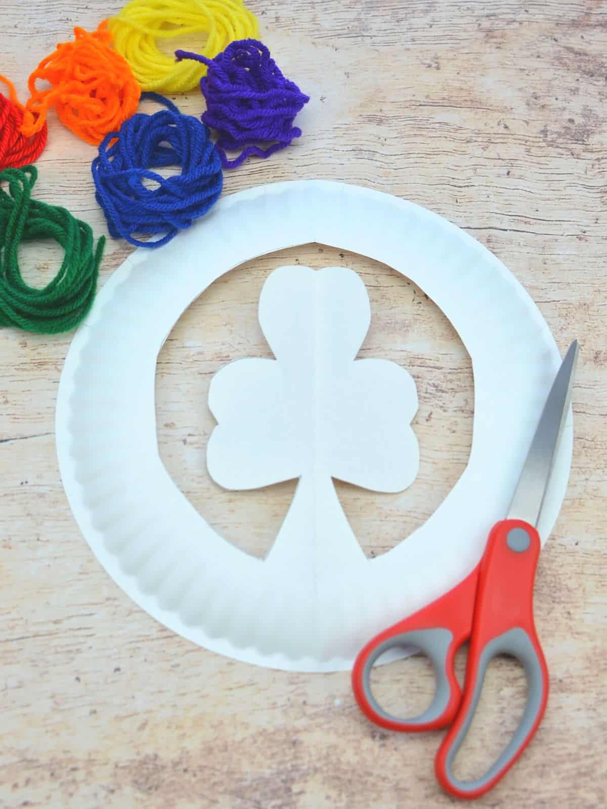 paper plate shamrock with scissors