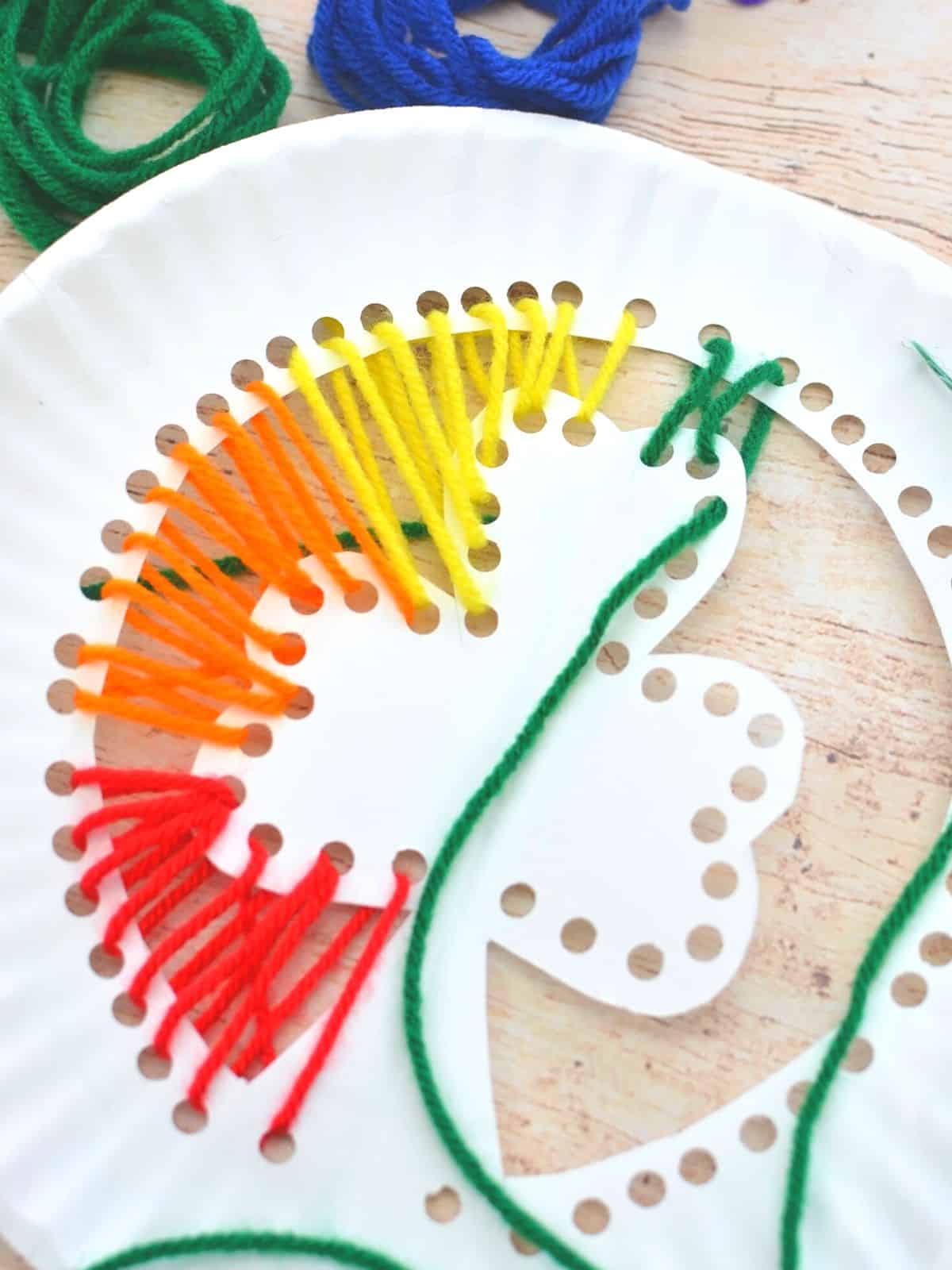 shamrock paper plate craft with yarn