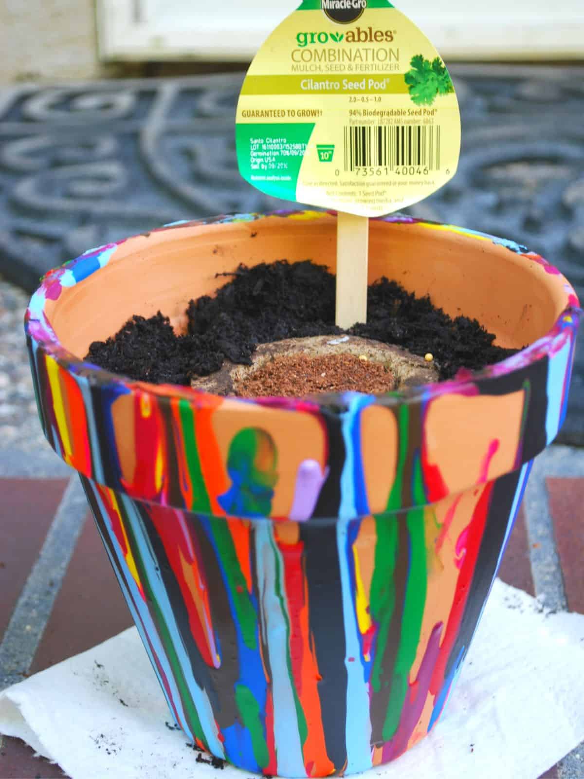 drip painted terracotta pot.
