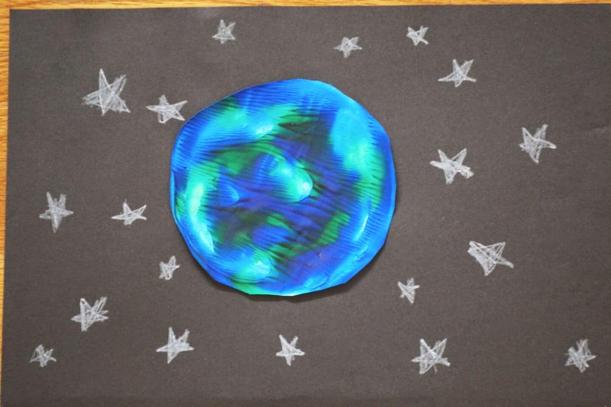 earth craft on black construction paper