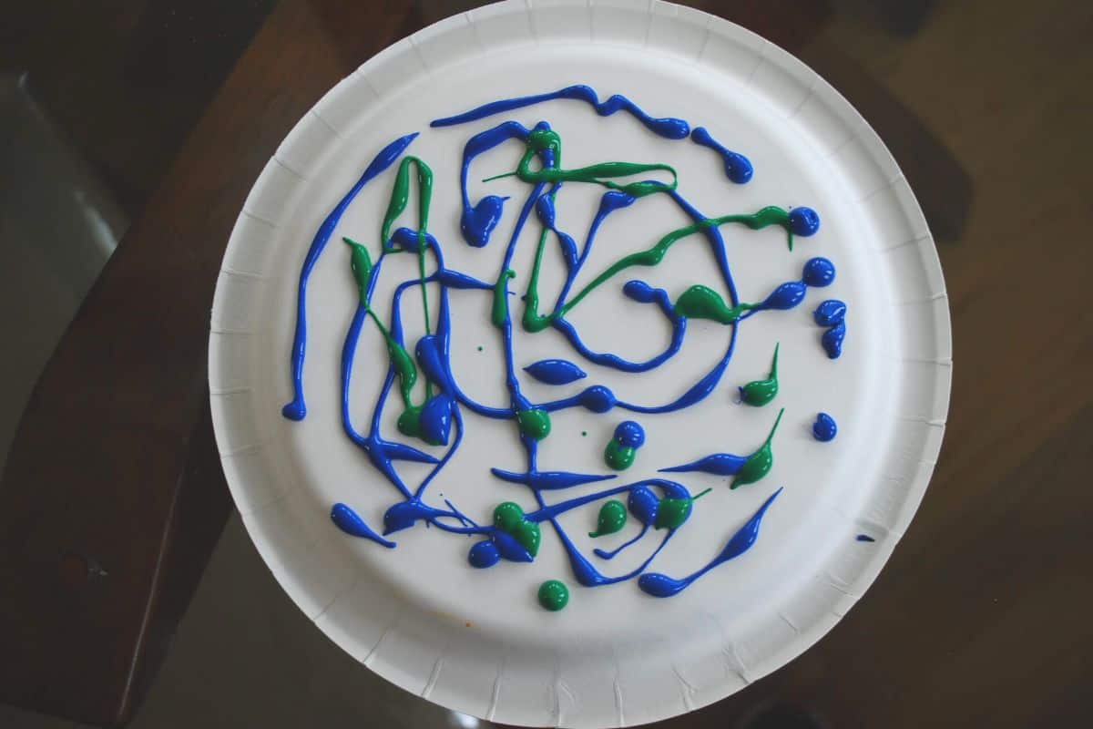 plate with blue and green paint.