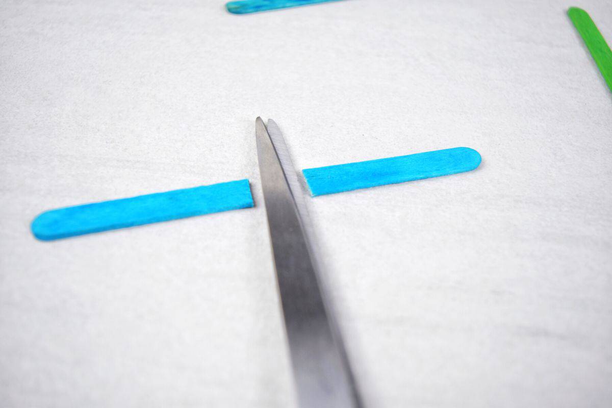 popsicle stick cut in half with scissors