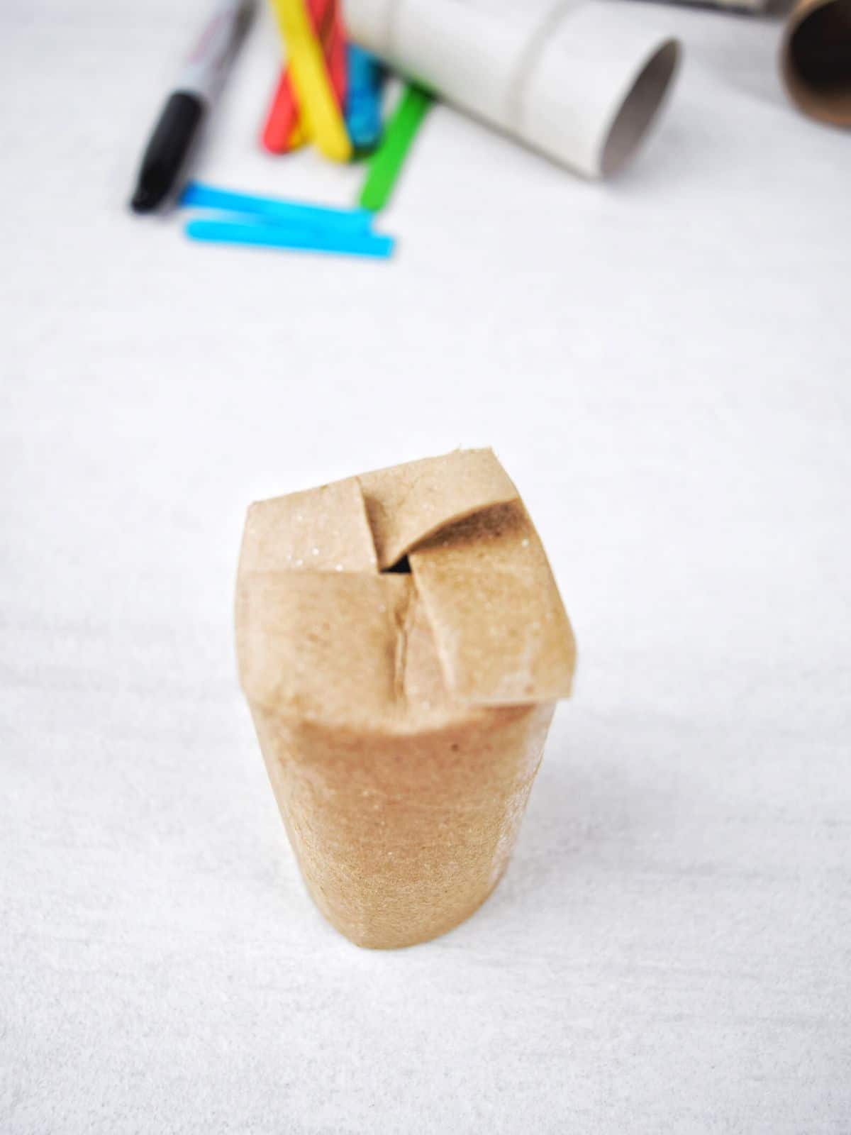 toilet paper tube with folded bottom