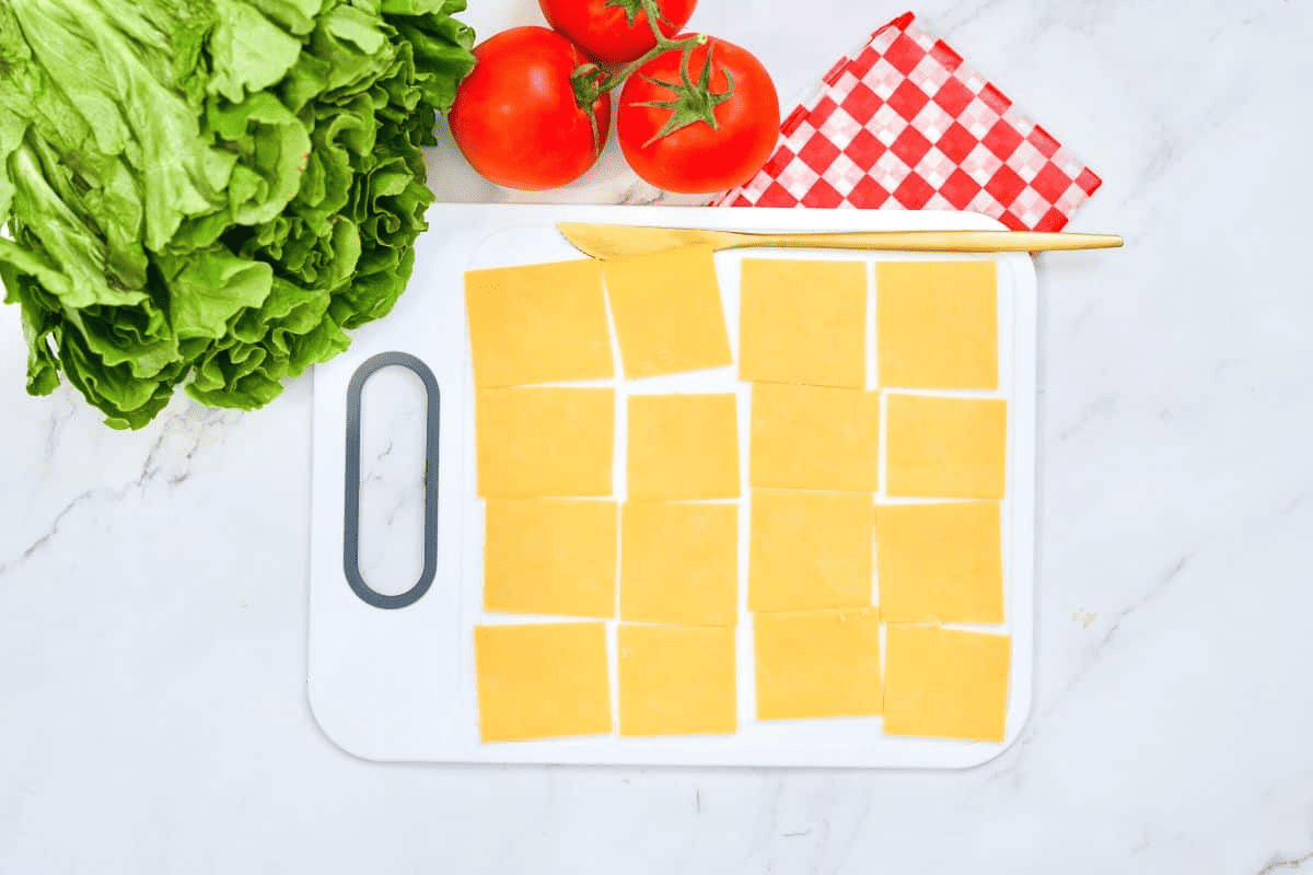 cheese slices on cutting board.