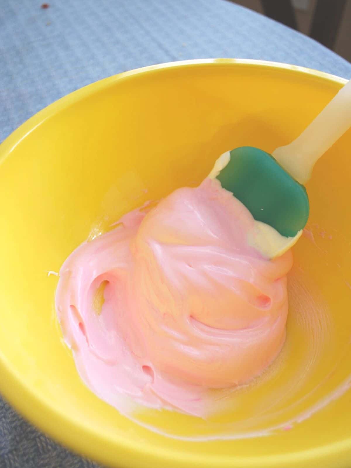 pink meringue in a mixing bowl.