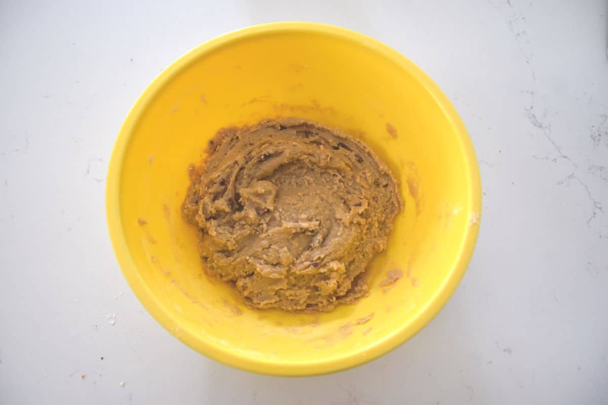 snickerdoodle cookie dough in yellow bowl