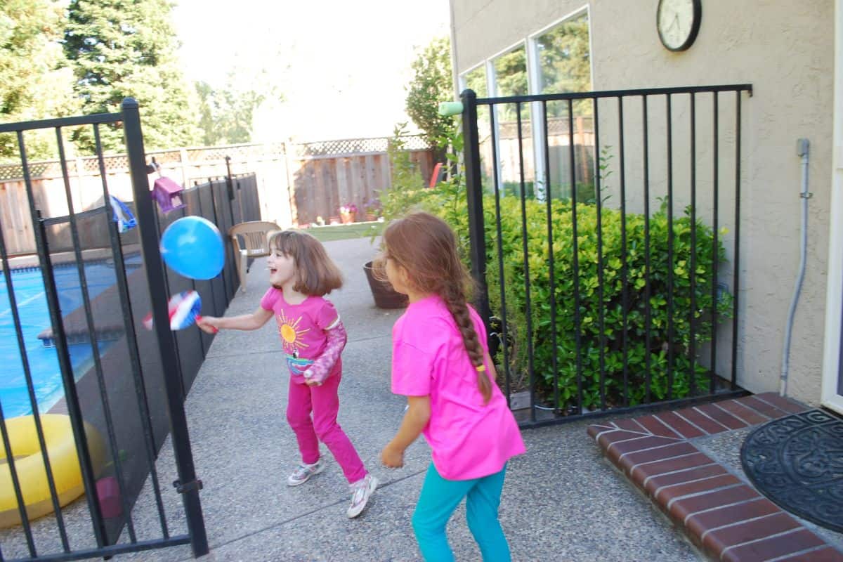 children playing with balloon
