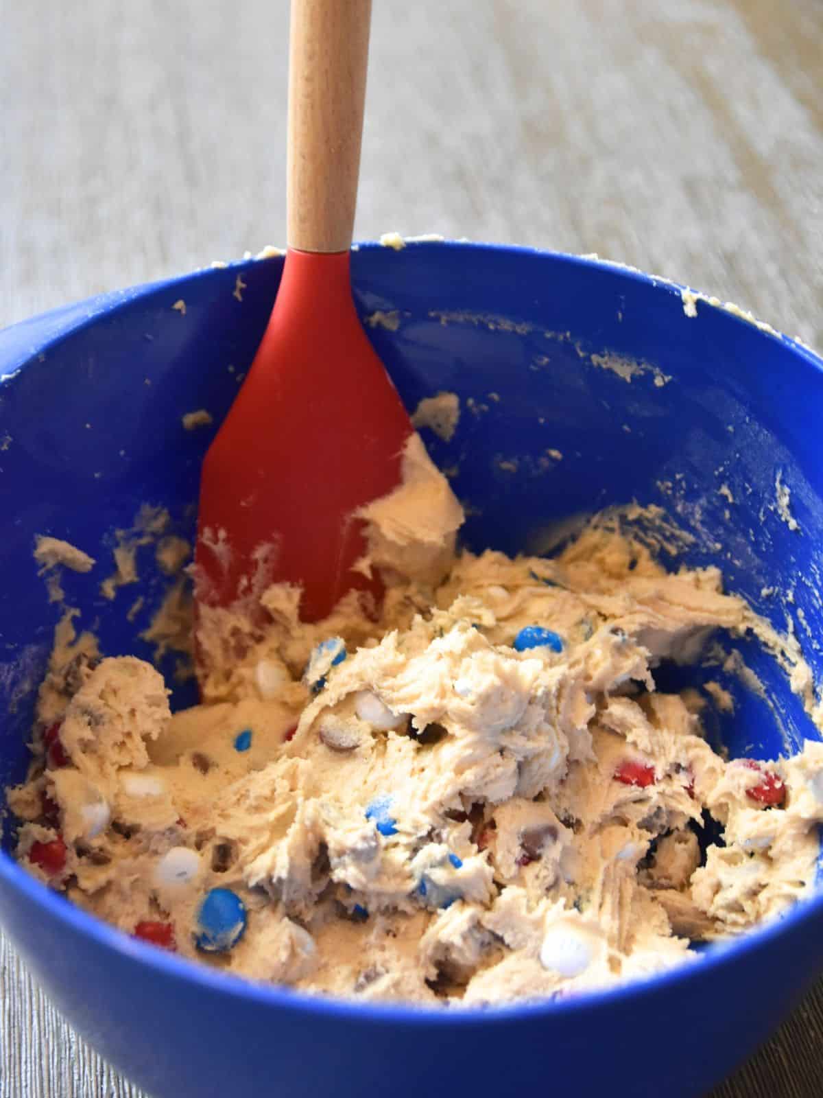 mixing cookie dough in bowl