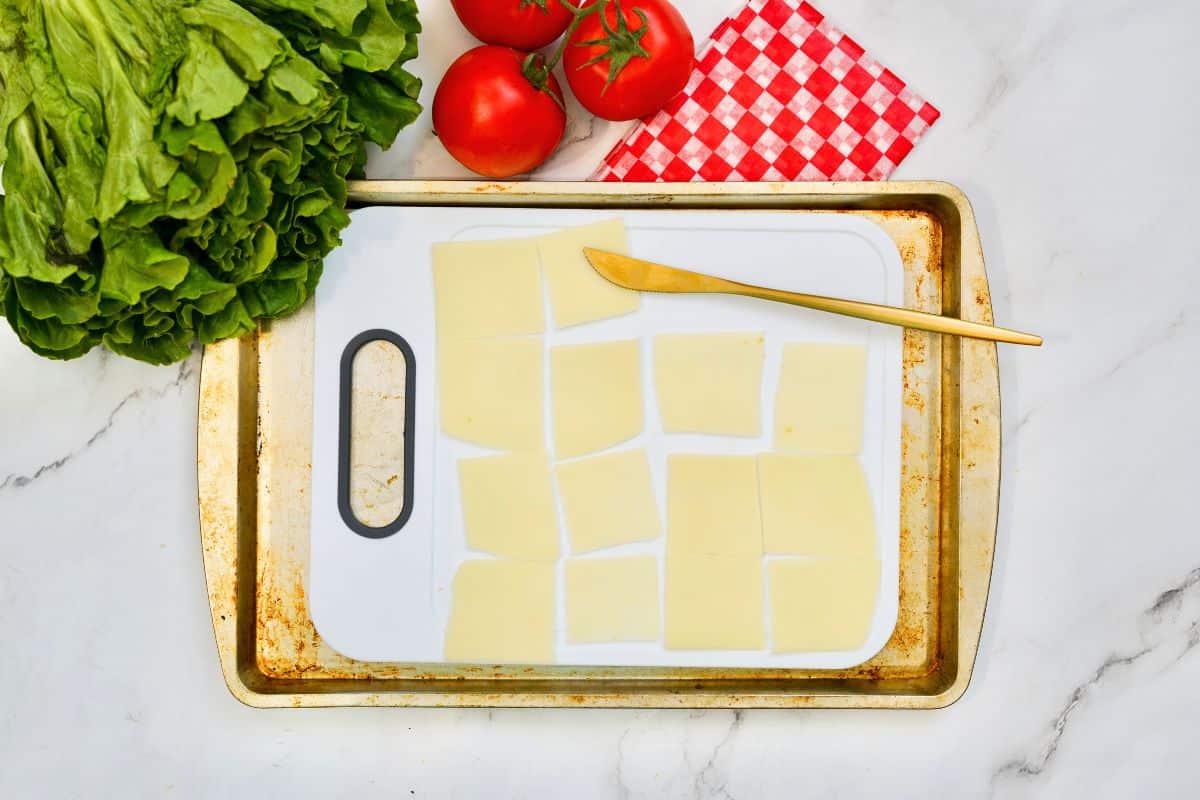 mozzarella slices on cookie sheet