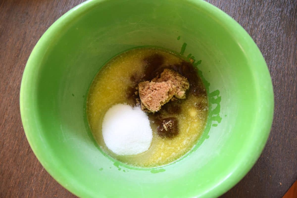 sugar eggs and melted butter in bowl