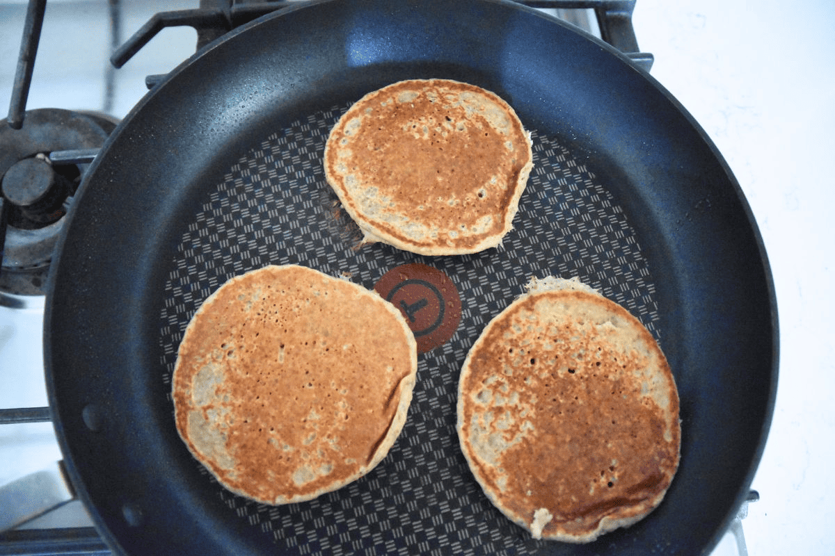 oat pancakes in skillet