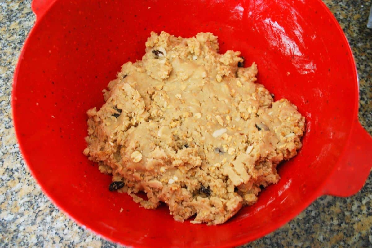 granola cookie dough in red bowl