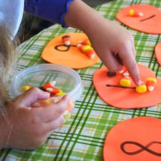 child counting candy corn
