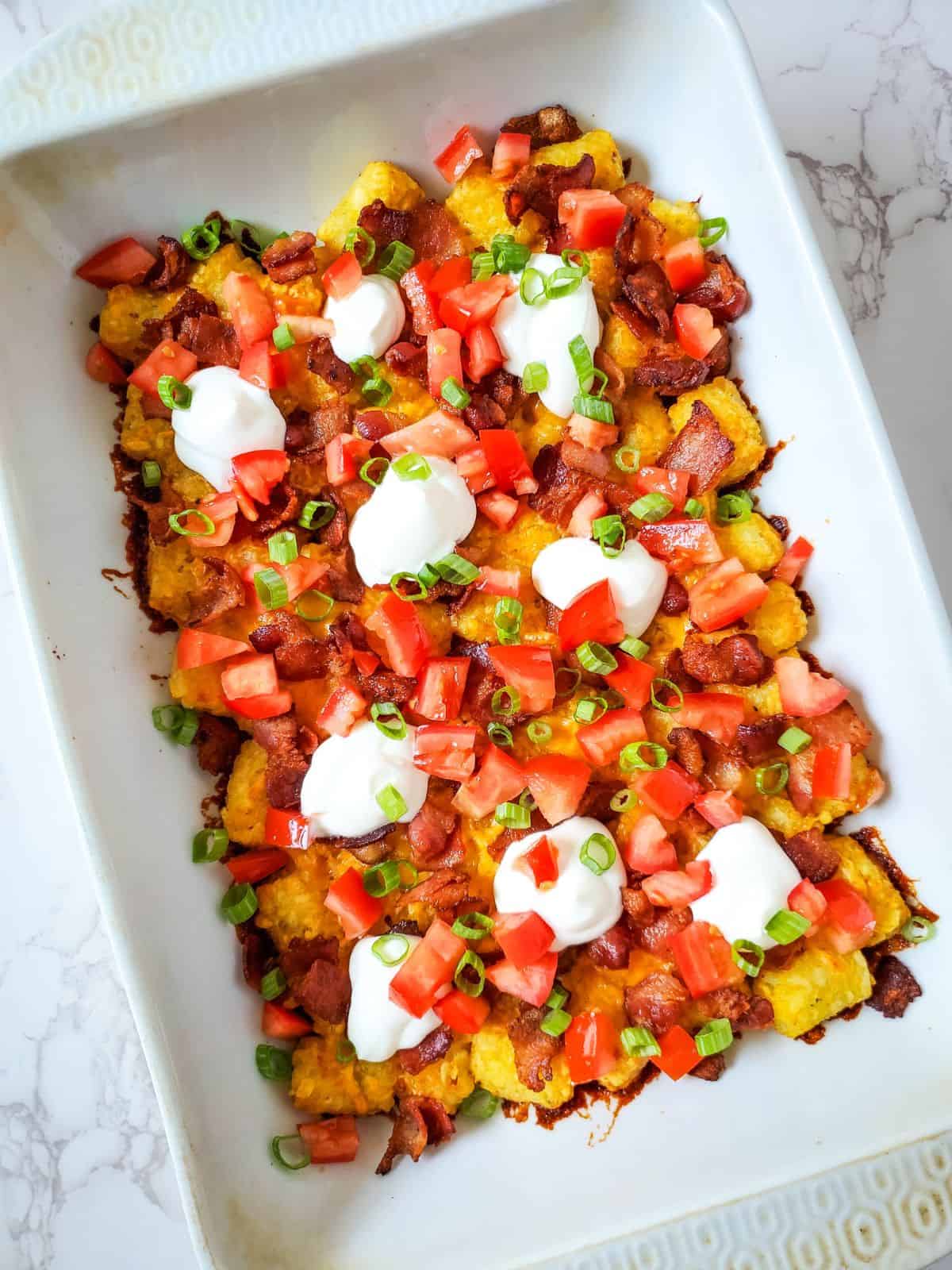 loaded tater tot casserole in pan.