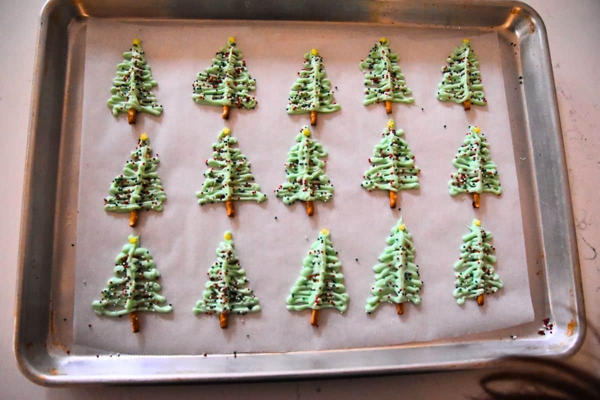christmas tree pretzels on cookie sheet.