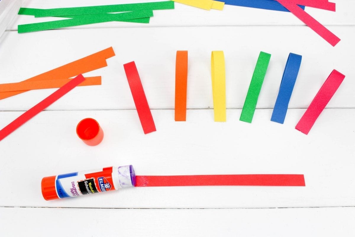 glue stick with red construction paper strip.