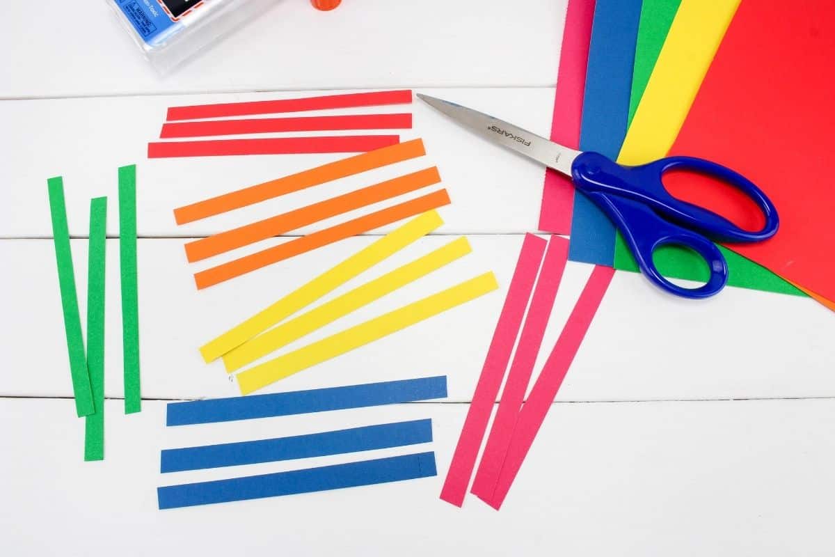 scissors with strips of colored construction paper.