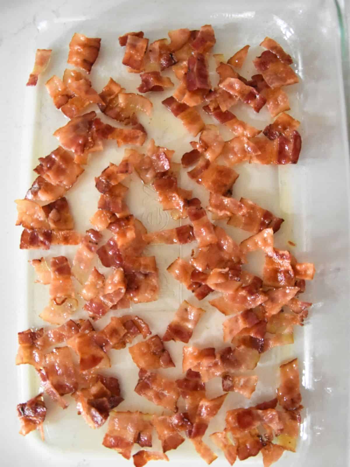crumbled bacon on casserole dish.