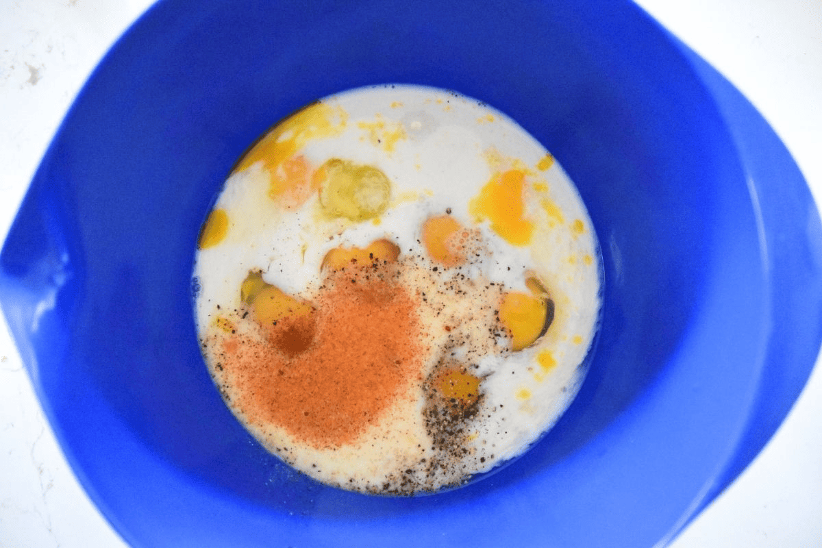 eggs milk and spices in bowl.