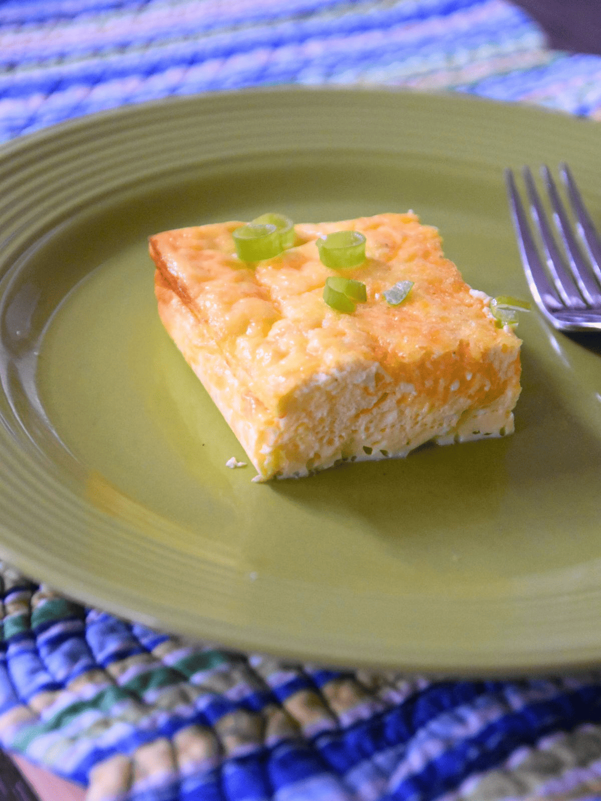 egg casserole on placemat.