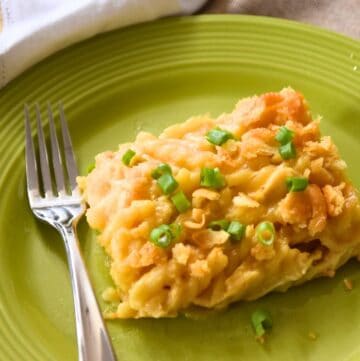 cheesy chicken casserole on plate with fork