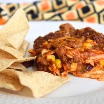 chili casserole on plate with chips