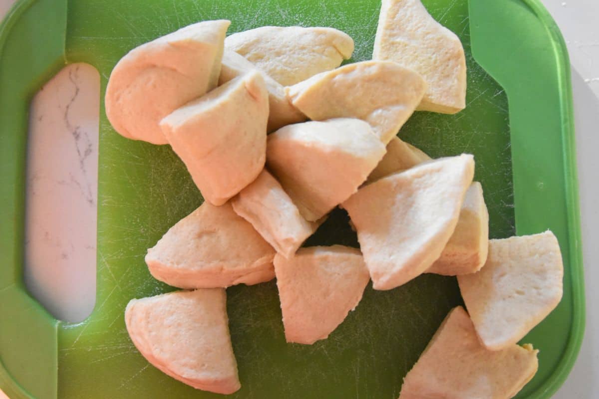 cut up biscuits on green cutting board