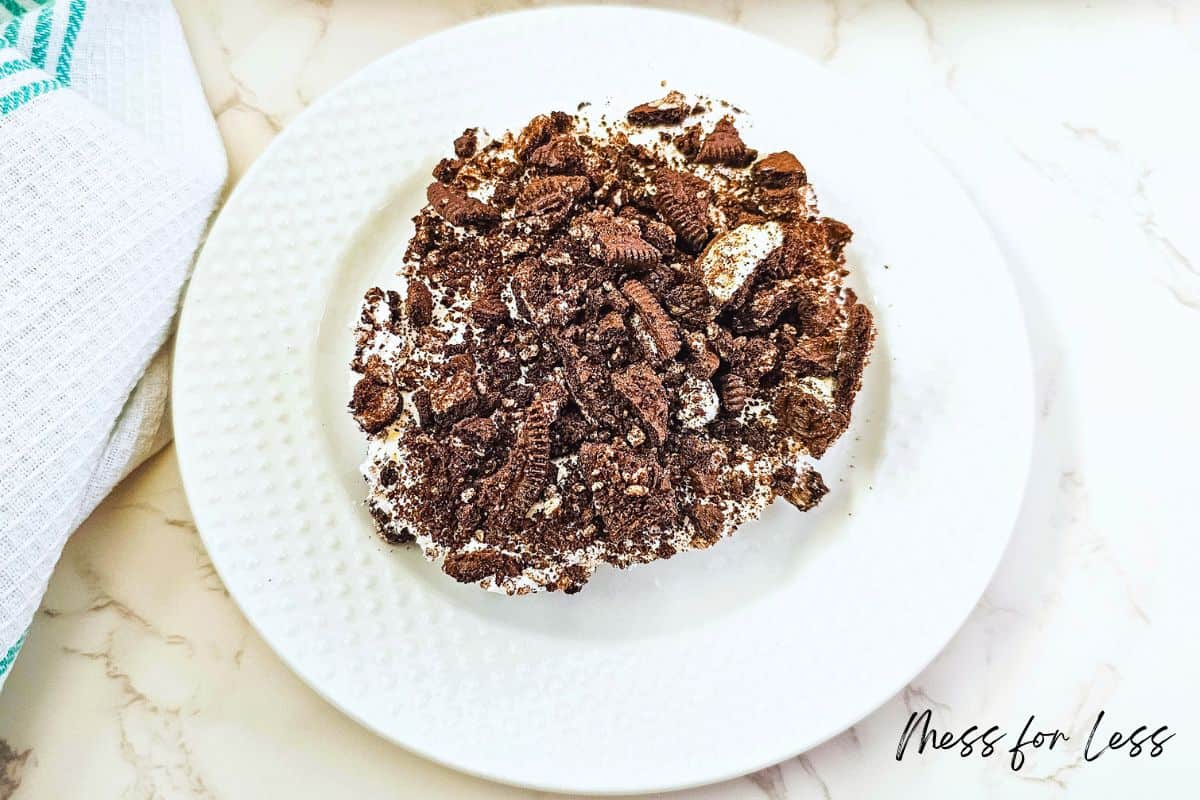 no bake dessert topped with crushed oreos