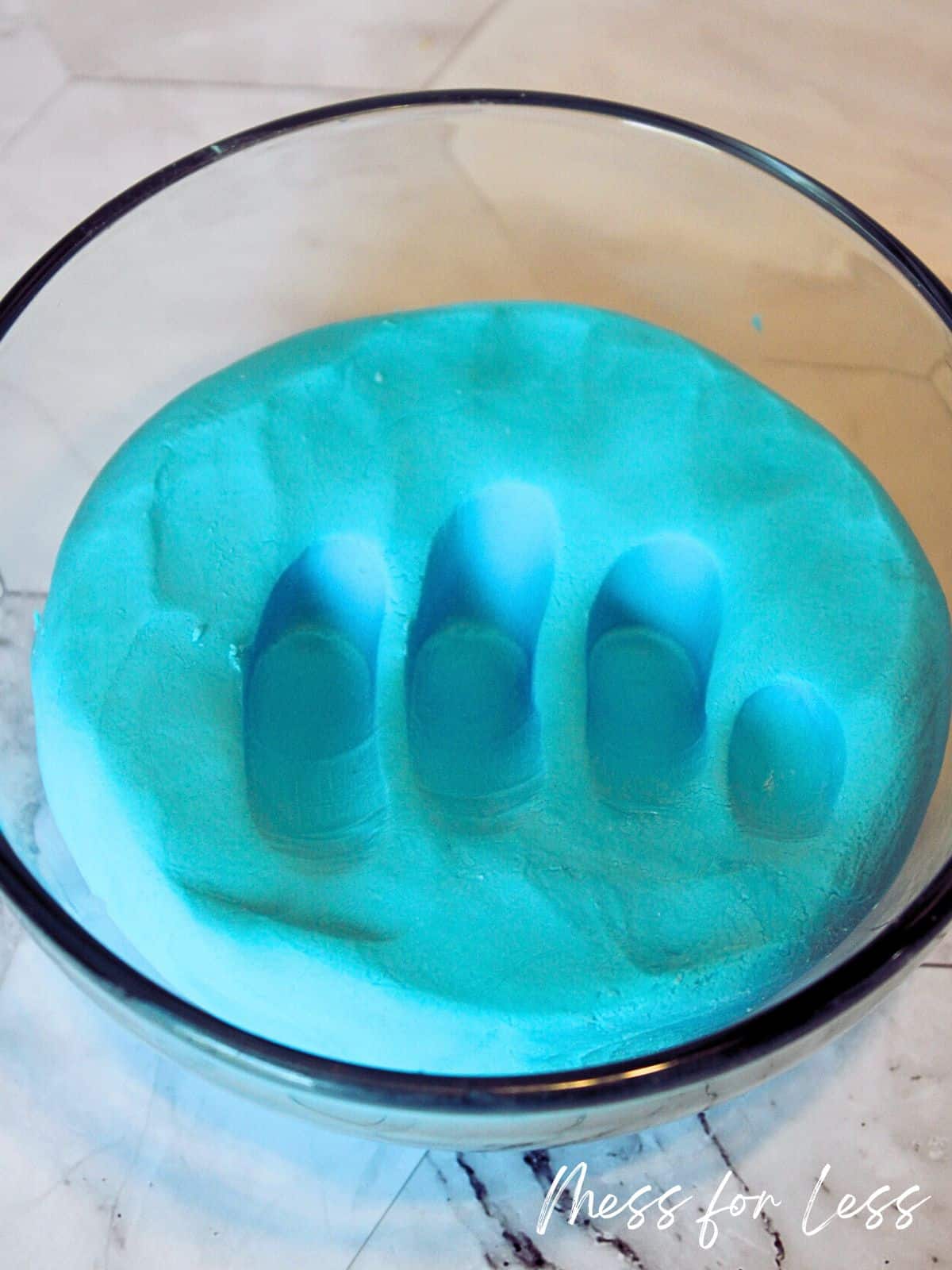 kneading blue playdough