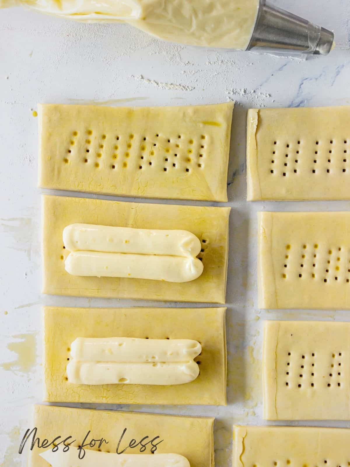 placing cheese filling on puff pastry