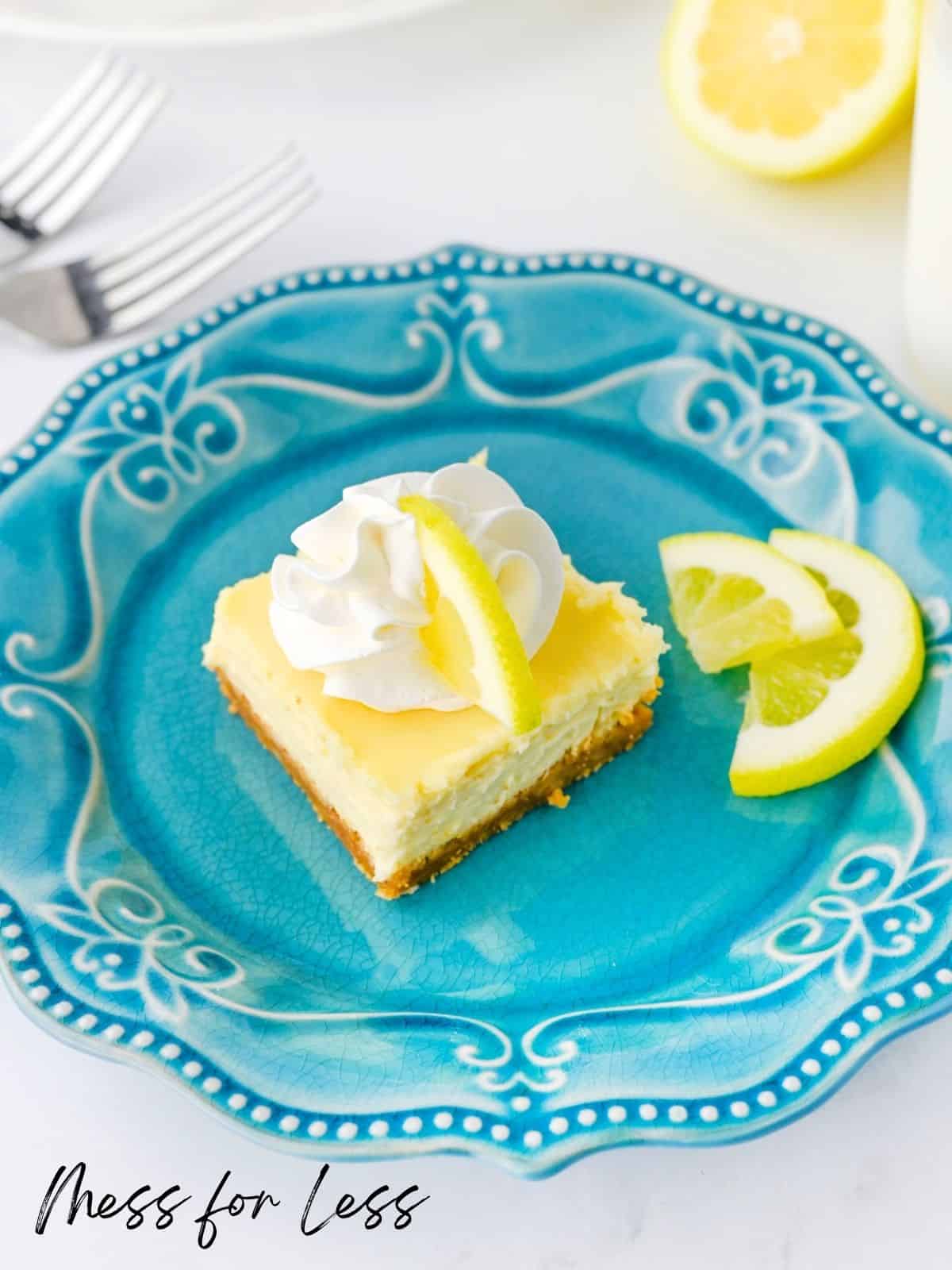 slice on lemon bar on blue plate