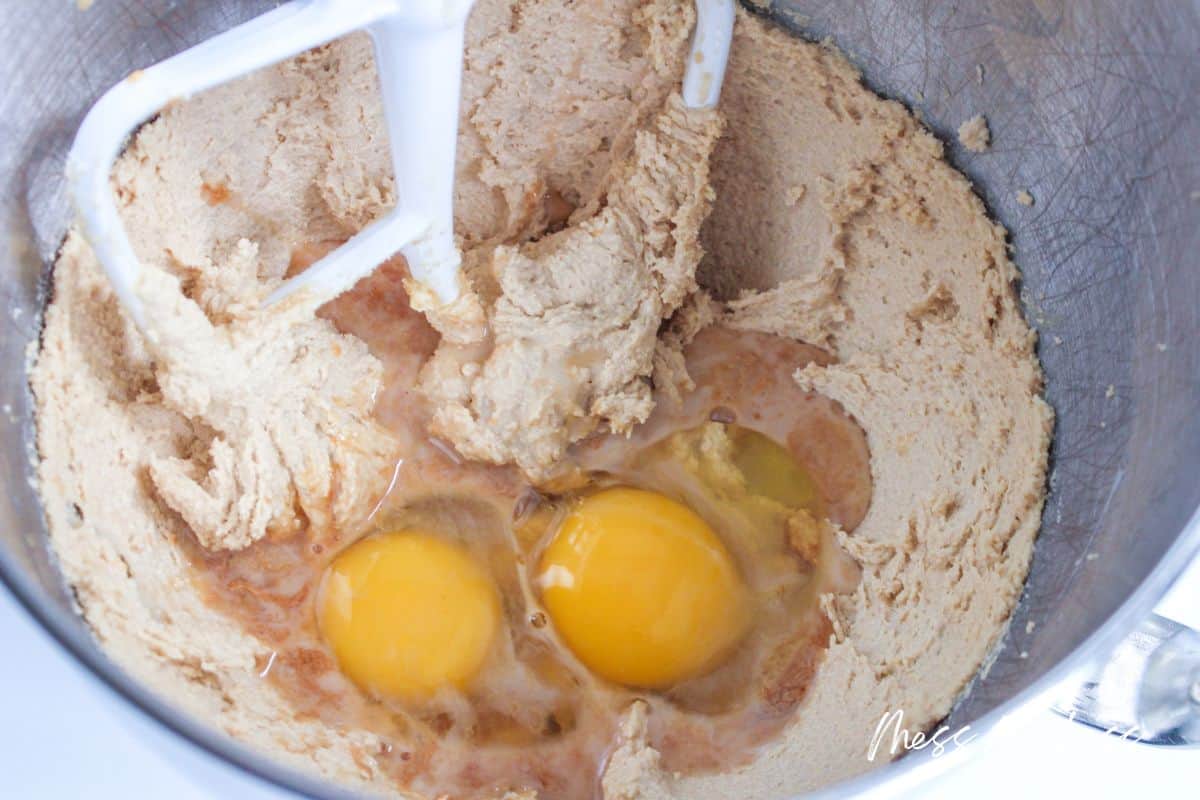 adding eegs to cookie dough in stand mixer