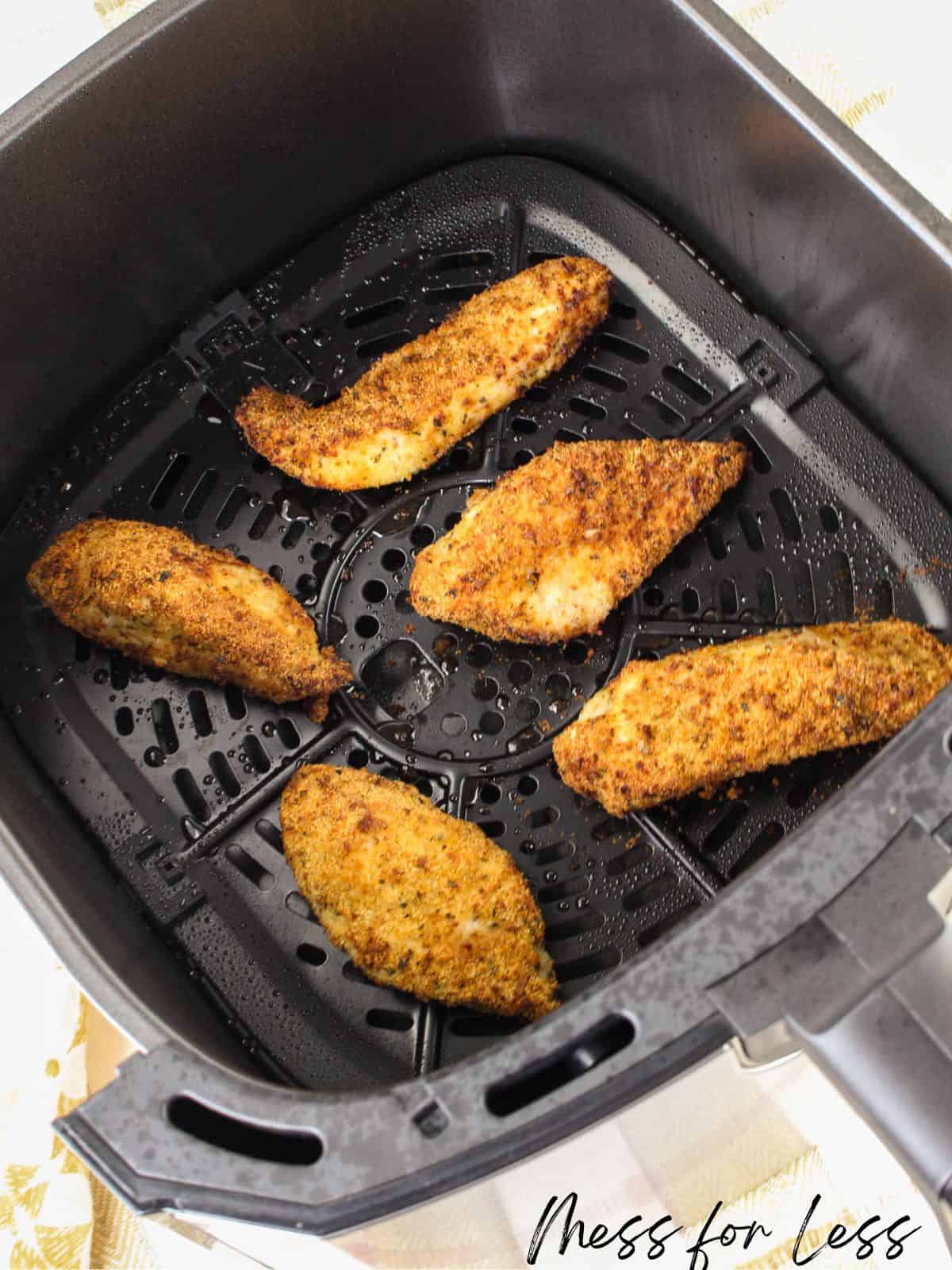air fryer with chicken in it