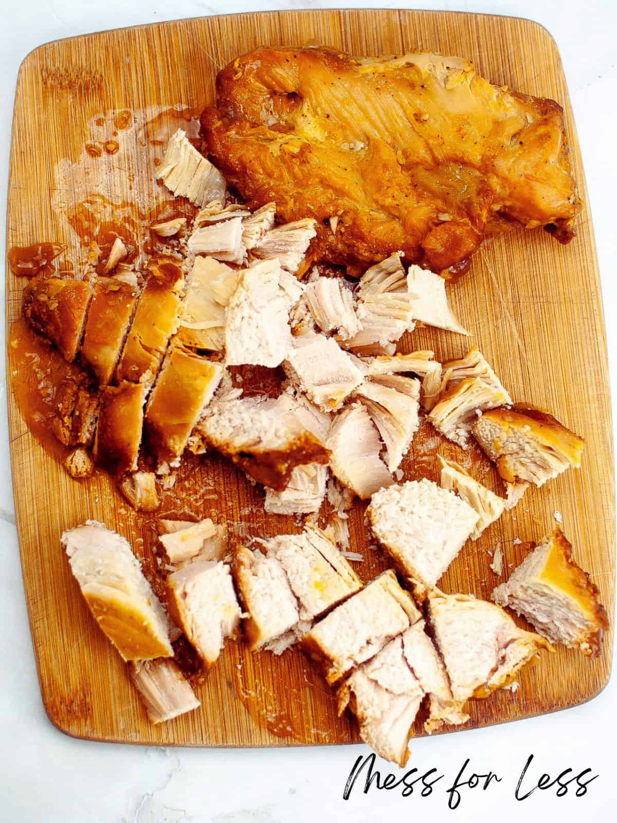 Sliced chicken on cutting board