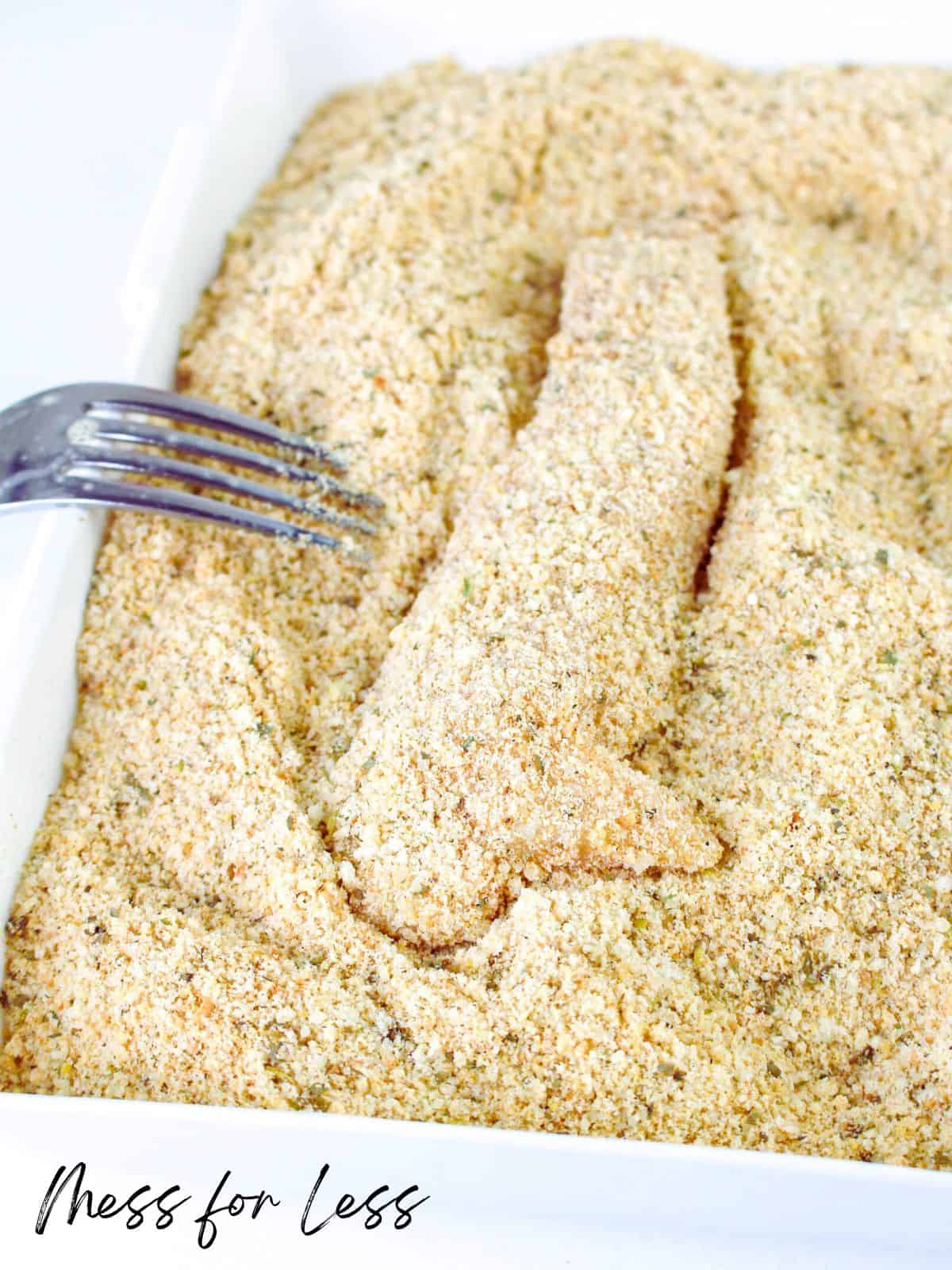 Dredging chicken in bread crumbs