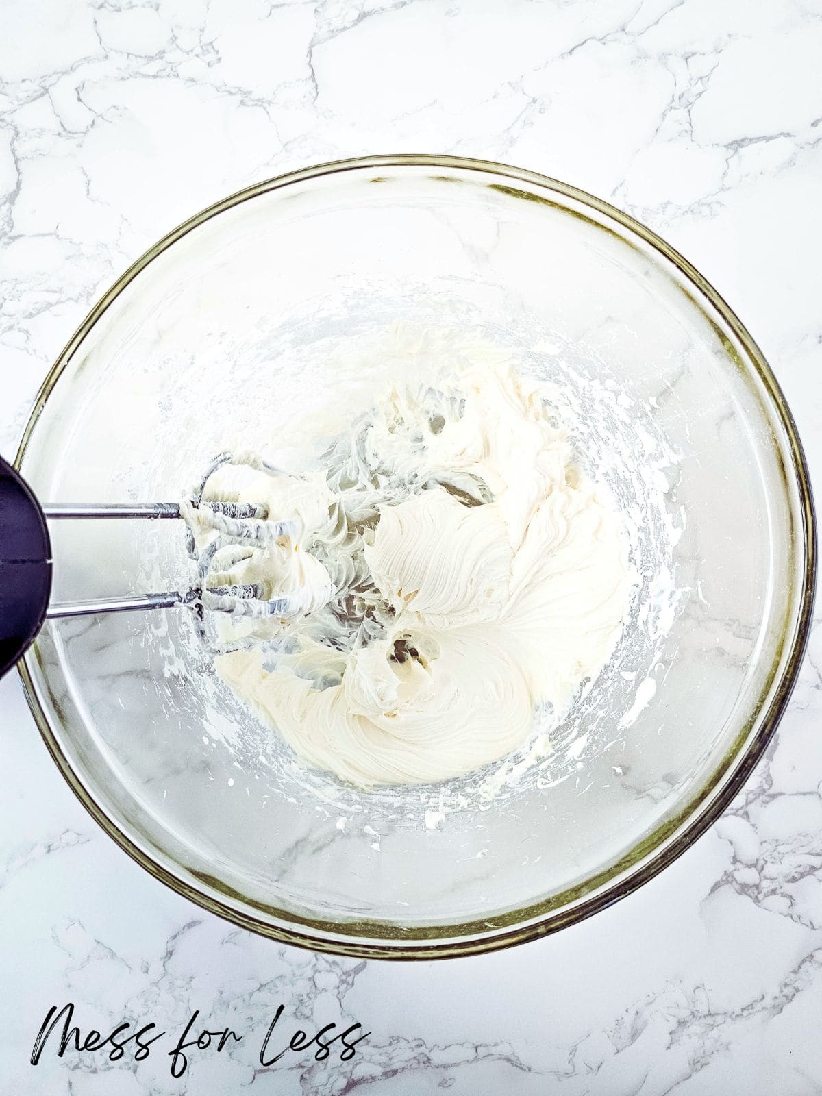 mixing cream cheese and sugar in bowl
