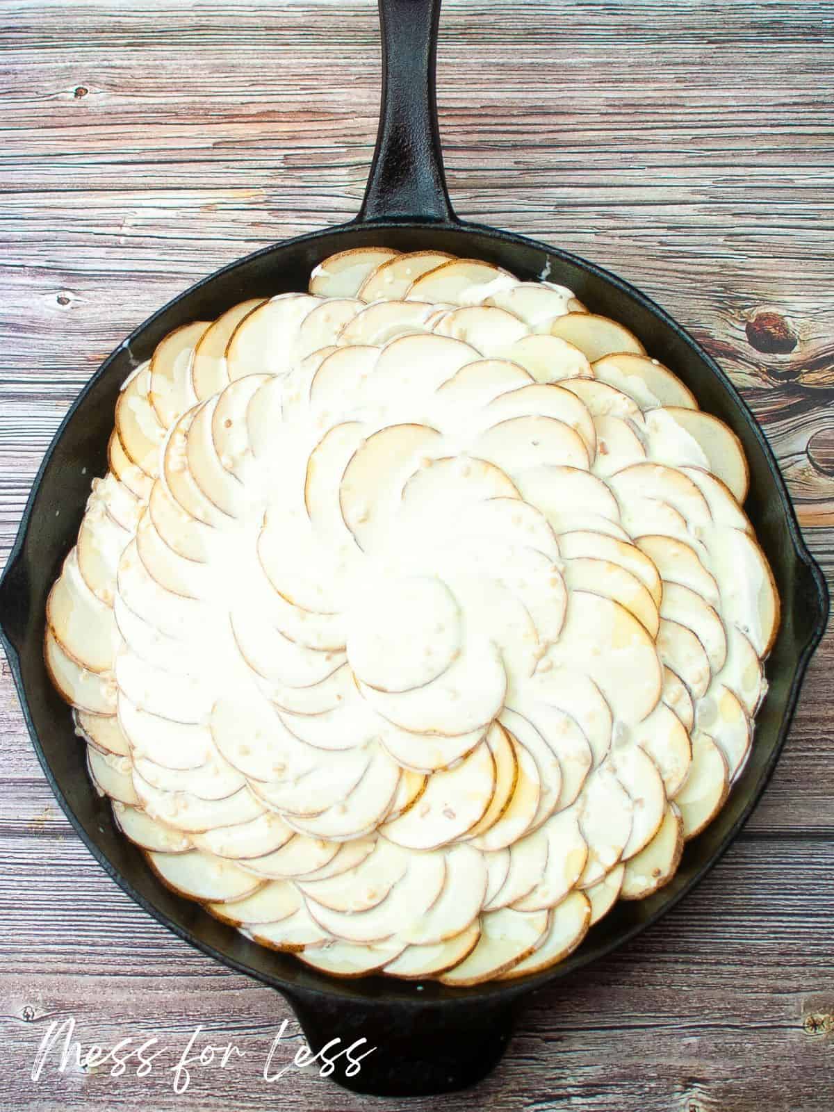 layered potatoes in skillet