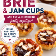 Mini phyllo baked brie and jam cups are filled with creamy brie, sweet jam, and sliced almonds on a white dish, with a jar of jam nearby.