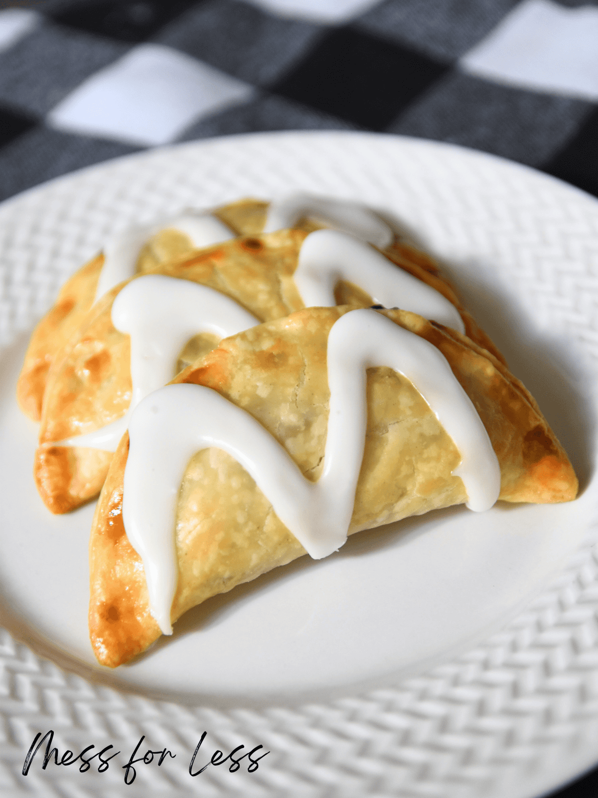 blueberry turnovers with glaze on plate