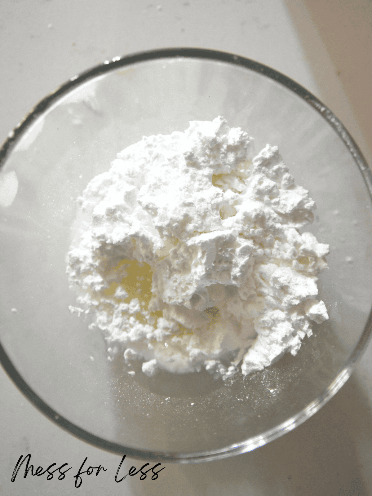 Powdered sugar and milk in bowl