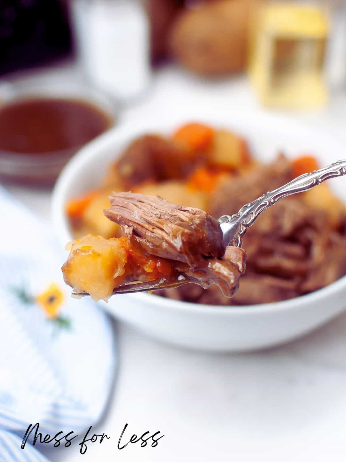 fork with pot roast on it